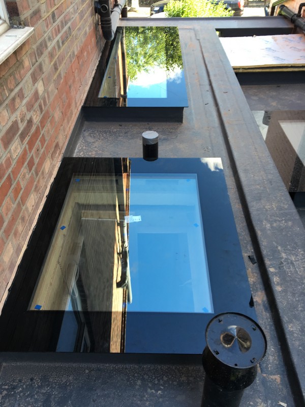 Multiple flat roof skylights on extension in East Ham
