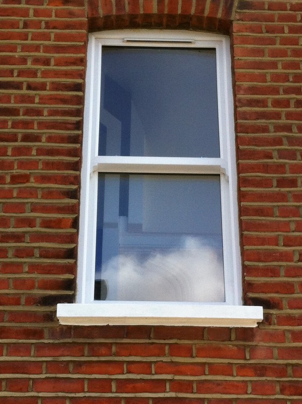 uPVC sash window on Victorian red brick house in East Ham